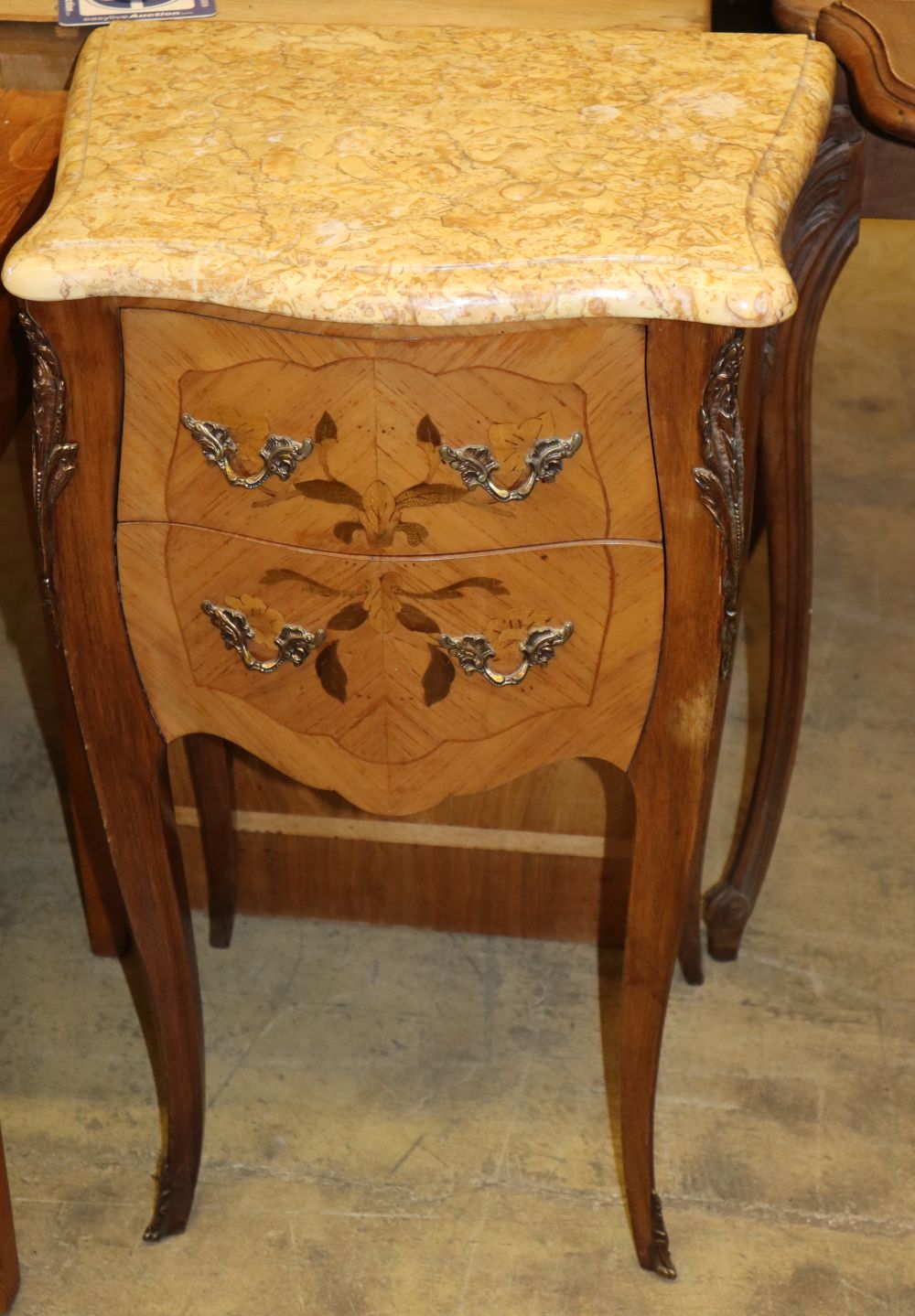 A pair of Louis XVI style marquetry inlaid marble topped serpentine bedside chests, W.44cm, D.31cm, H.76cm